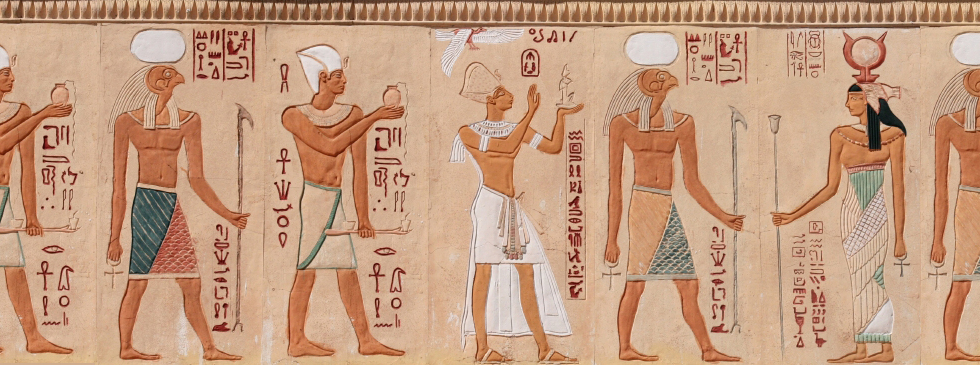 Egyptian figures and hieroglyphics in stone relief